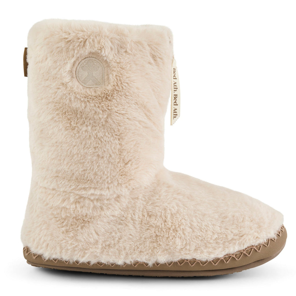 Beige slipper boot with fuzzy texture on a white background