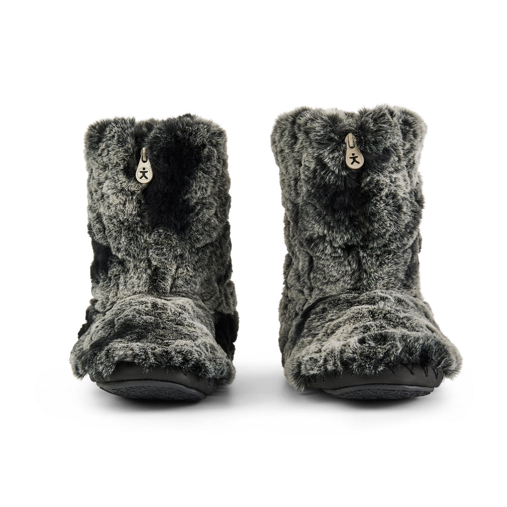 Pair of grey fuzzy slippers on a white background