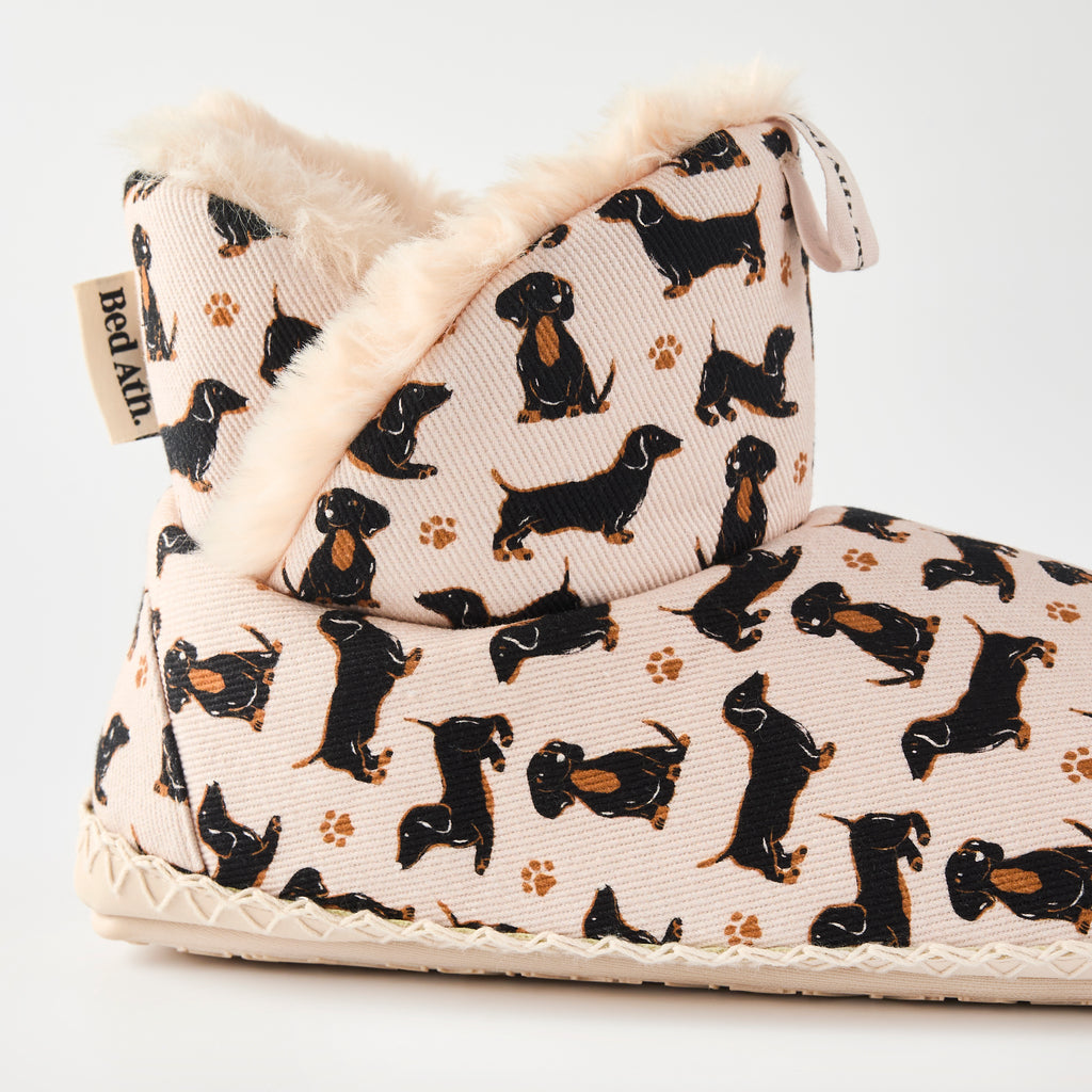 ankle slipper boots with dachshund pattern on a white background