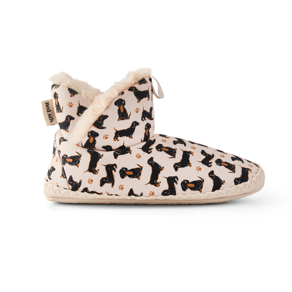 Slipper with dachshund pattern on a white background