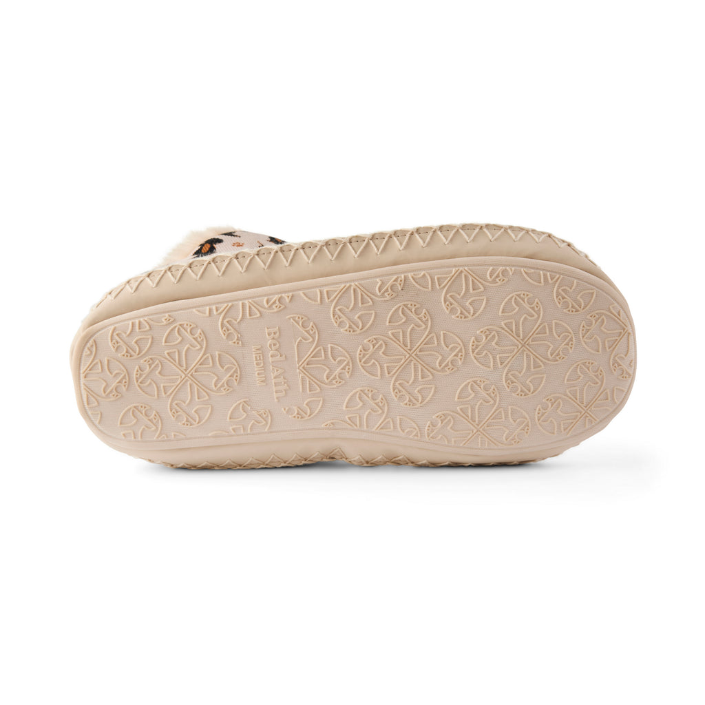 Beige sandal sole with brand logo on a white background