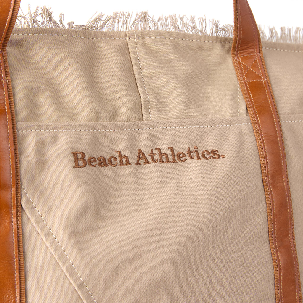 Bonnie bag (a beige washed canvas beach bag), close-up of the stitched branding