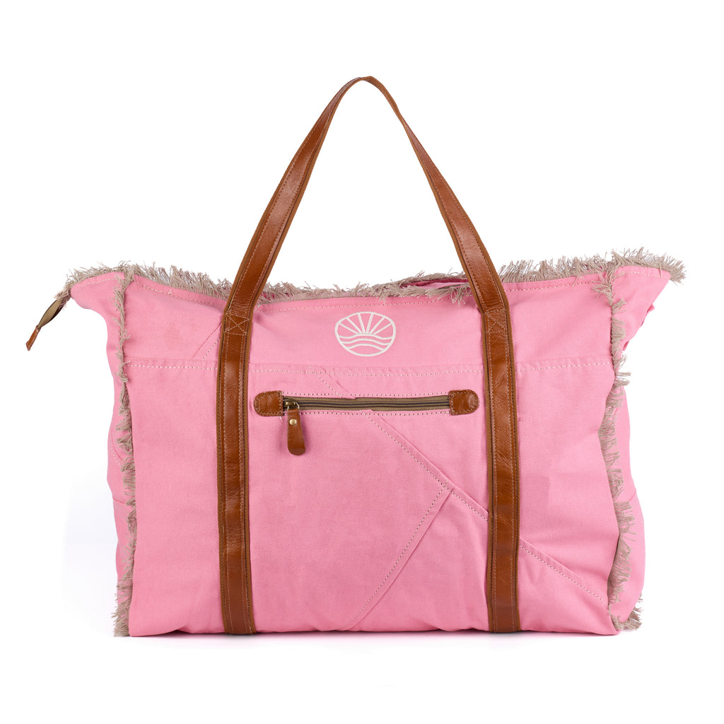 Bonnie: a pink washed canvas beach bag with frayed raw edges, tan leather handles and trim, and an embroidered Beach Athletics logo, back view