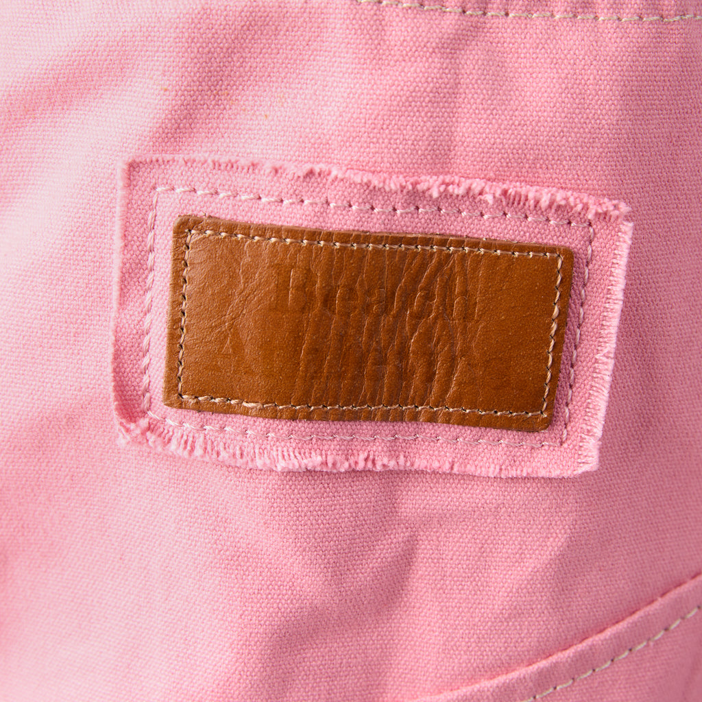 Bonnie bag (a pink washed canvas beach bag), close-up of the branded leather logo patch