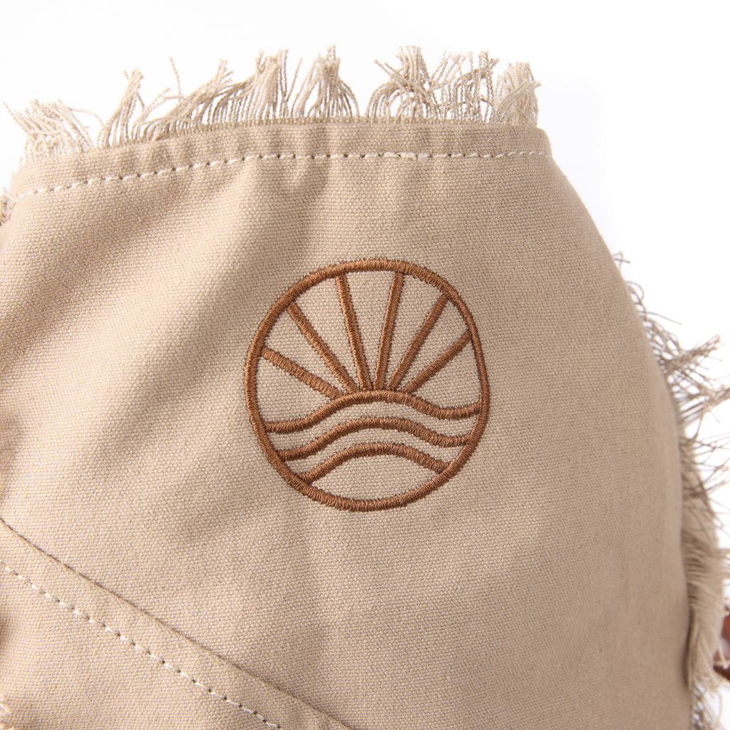 Casey bag (a beige washed canvas beach bag), close-up of the embroidered Beach Athletics logo
