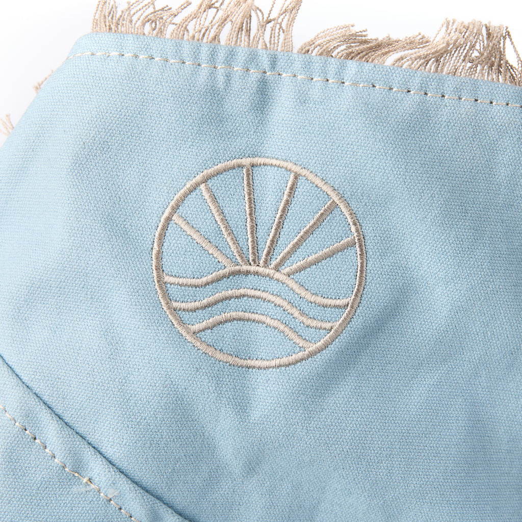 Casey bag (a blue washed canvas beach bag), close-up of the embroidered Beach Athletics logo