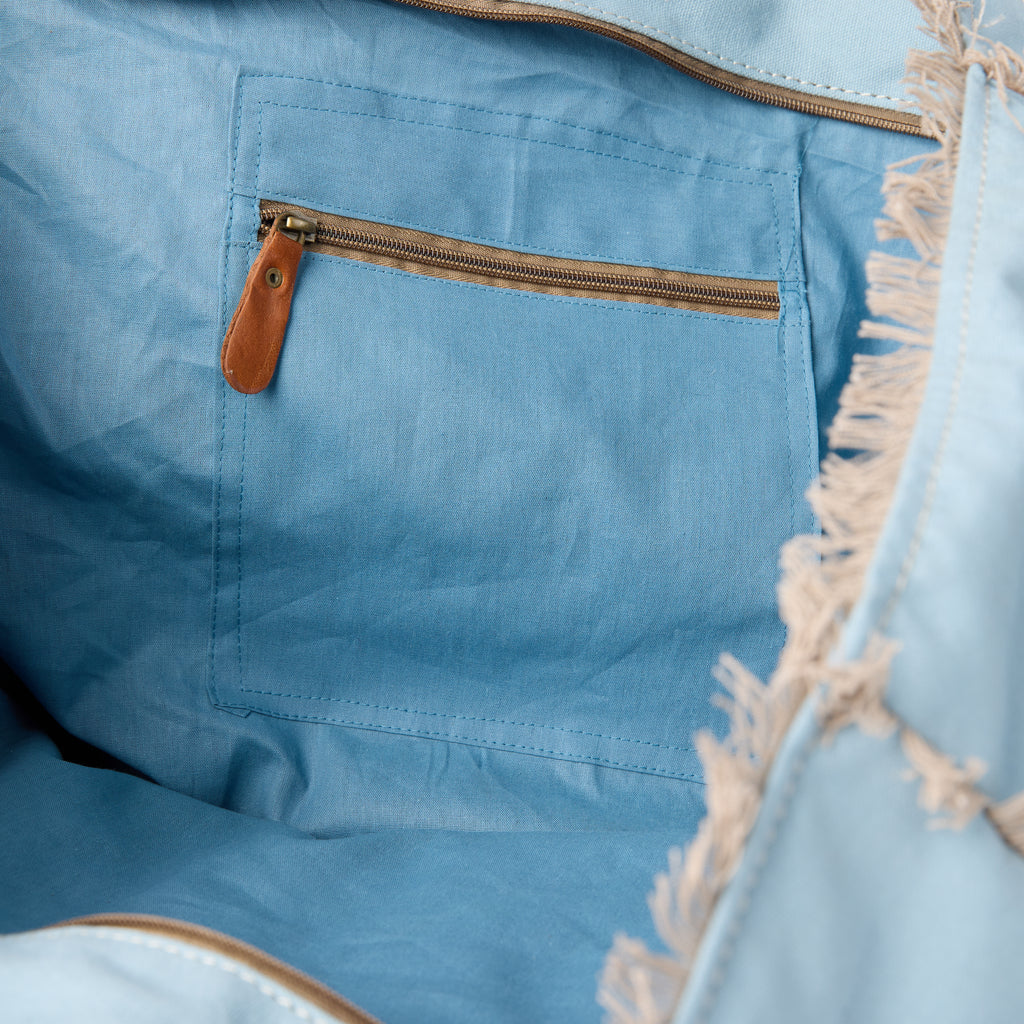 Casey bag (a blue washed canvas beach bag), interior view showing an inside pocket