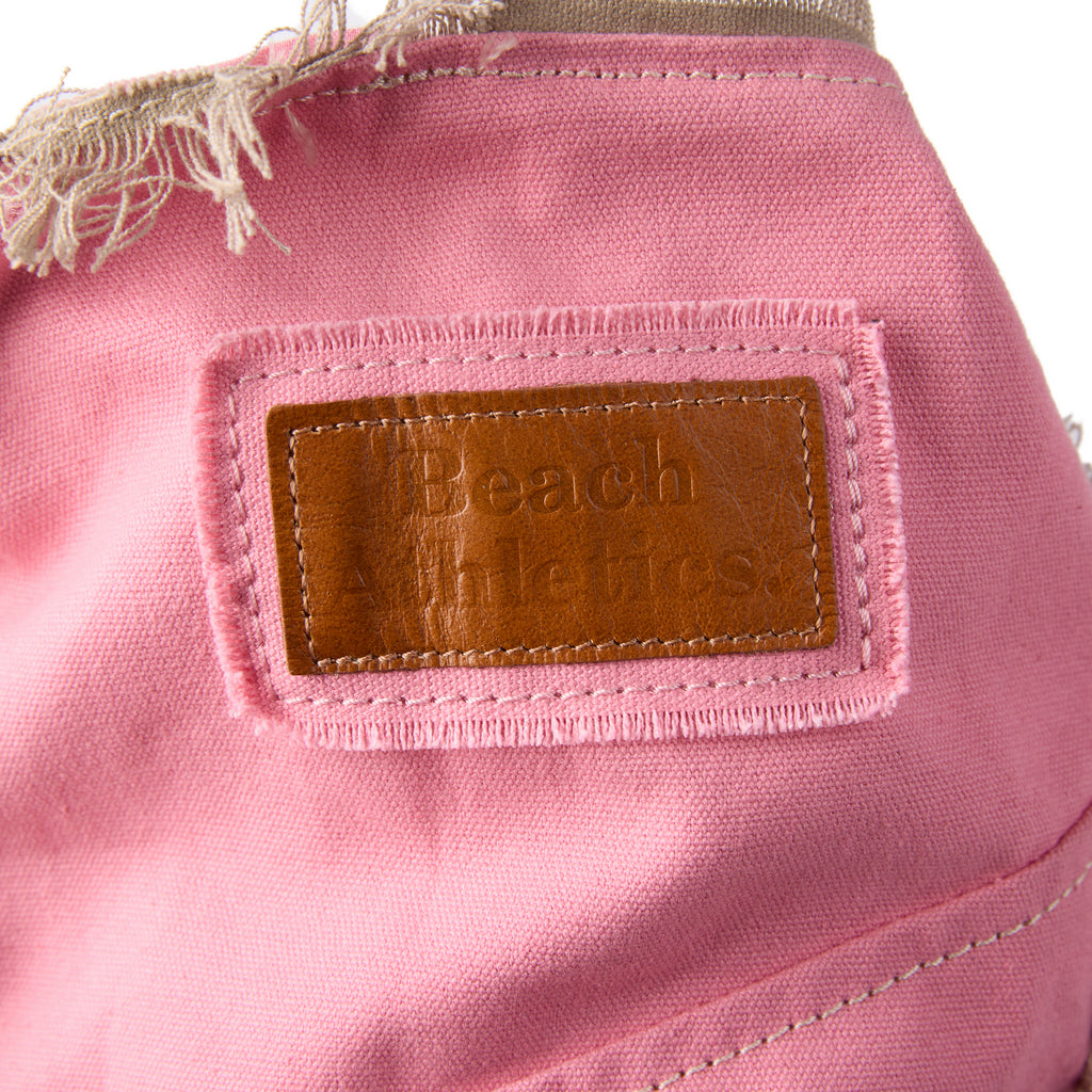 Casey bag (a pink washed canvas beach bag), close-up of the embroidered Beach Athletics logo patch