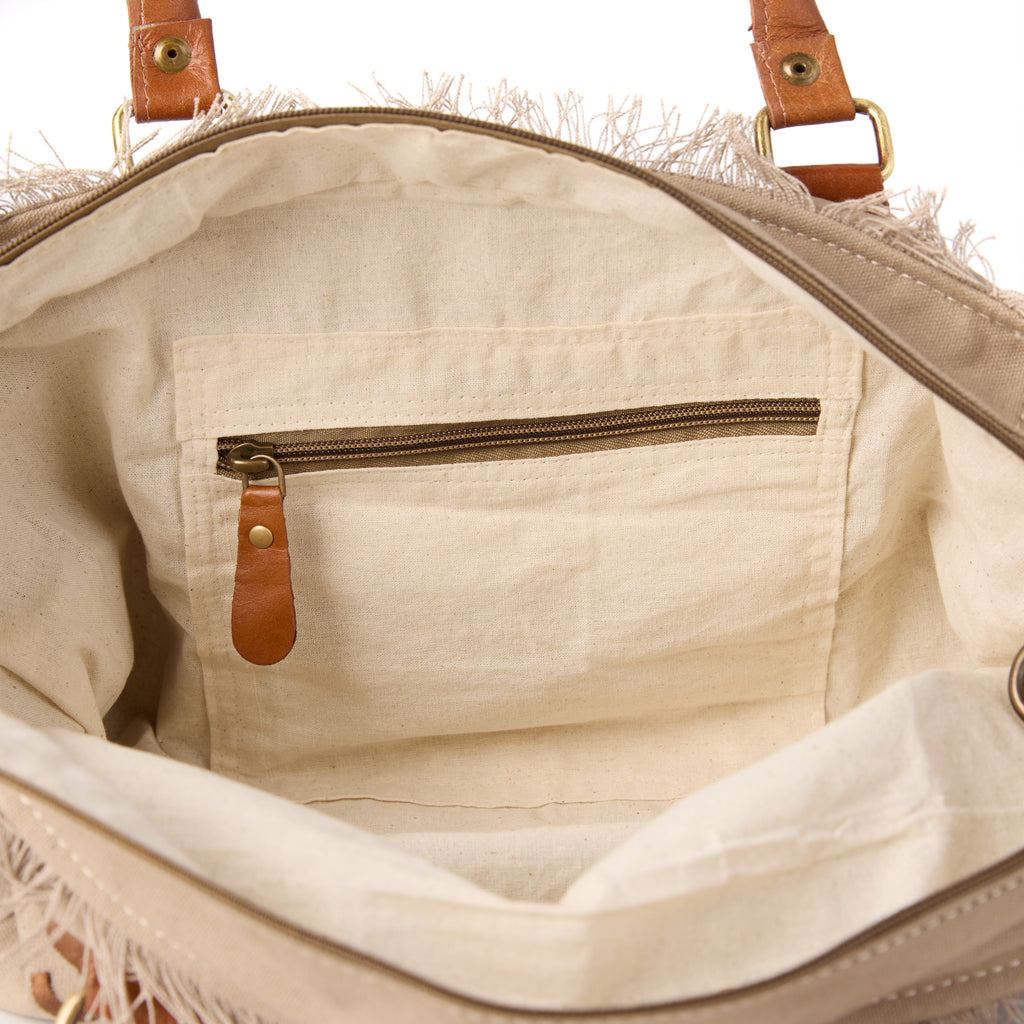 Lani bag (a beige washed canvas shoulder bag), interior view showing an inside pocket