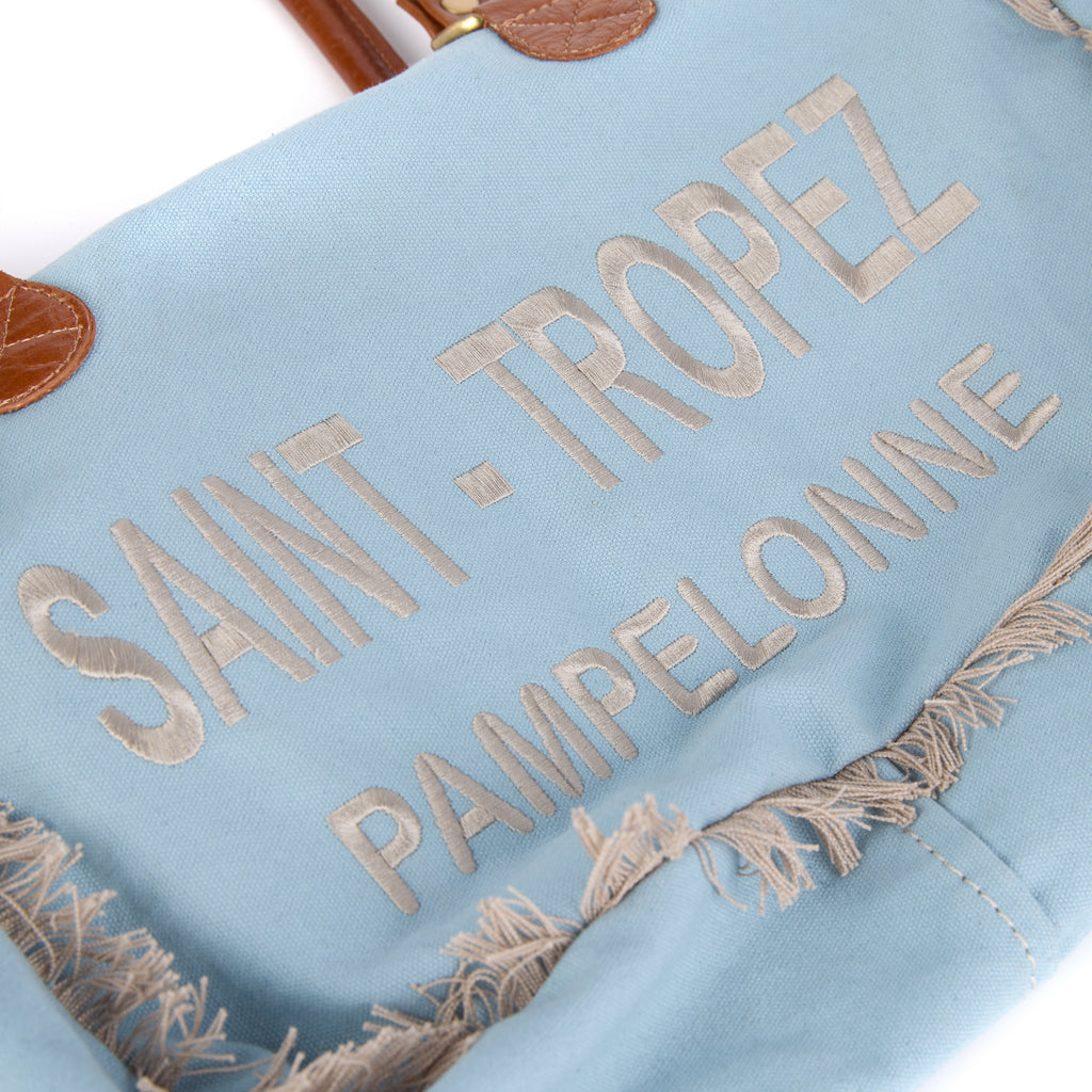 Lani bag (a blue washed canvas shoulder bag), close-up of a front detail