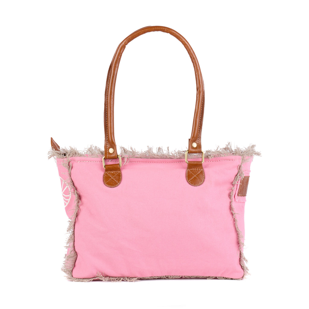 Shauni: a pink washed canvas shoulder bag with frayed raw edges, tan leather trim and an embroidered sunrise Beach Athletics logo, back view
