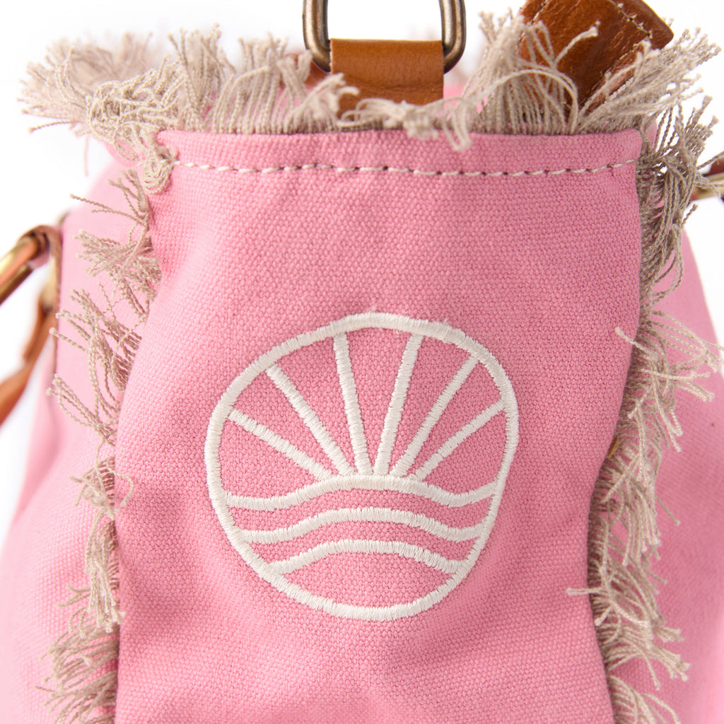 Shauni bag (a pink washed canvas shoulder bag), close-up of the embroidered Beach Athletics logo