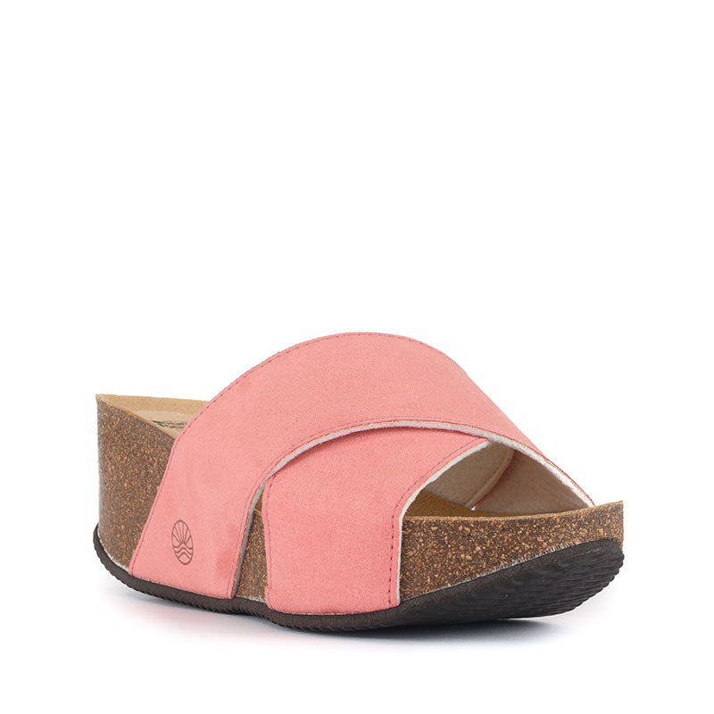 The Inis Vegan Wedge Crossover Slider in Pink has elegant style and comfort combined. Bedroom Athletics offers a wide range of premium quality slippers, slip on boots and loungewear.