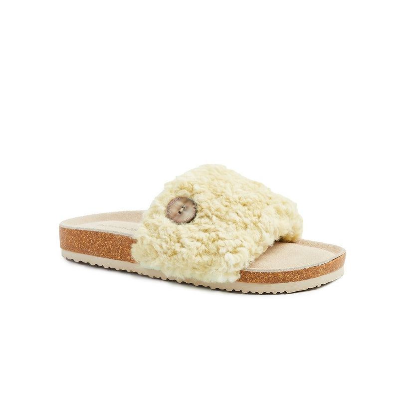 The Women's Poppy Luxury Faux Fur Slipper Slider in Yellow has a cork wedge and oversized shell button give the Poppy a summer beach vibe. Bedroom Athletics offers a wide range of premium quality slippers, slip on boots and loungewear.