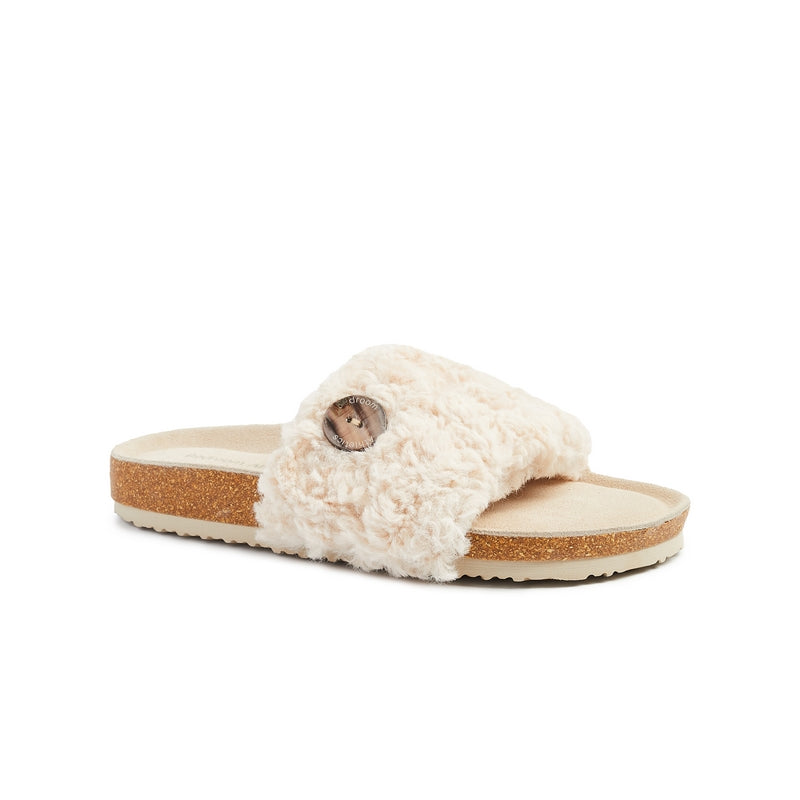 The Women's Poppy Luxury Faux Fur Slipper Slider in Cream has a cork wedge and oversized shell button give the Poppy a summer beach vibe. Bedroom Athletics offers a wide range of premium quality slippers, slip on boots and loungewear.